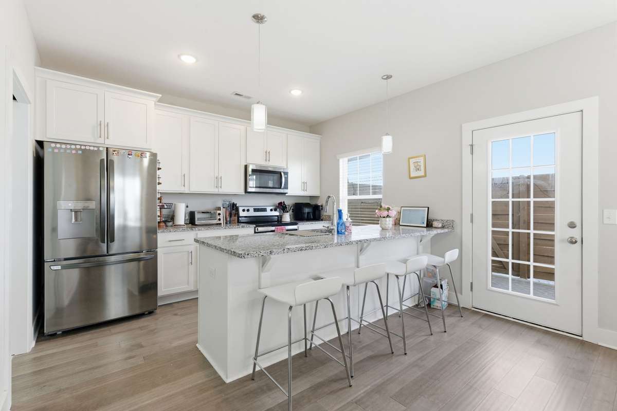 Well-appointed kitchen with ample cabinetry, counter space, and convenient, open layout.