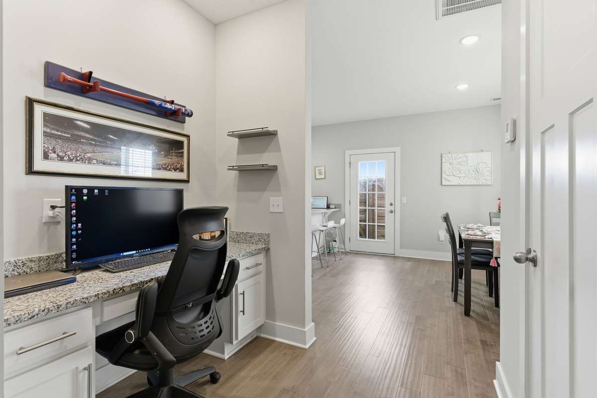 Versatile flex space with built-in countertop, perfect for a home bar, coffee station, or convenient workspace.