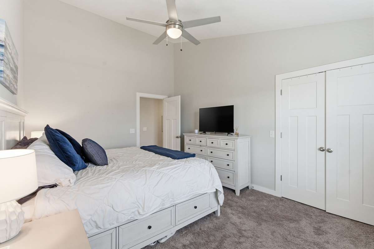 The spacious walk-in closet offers abundant storage.
