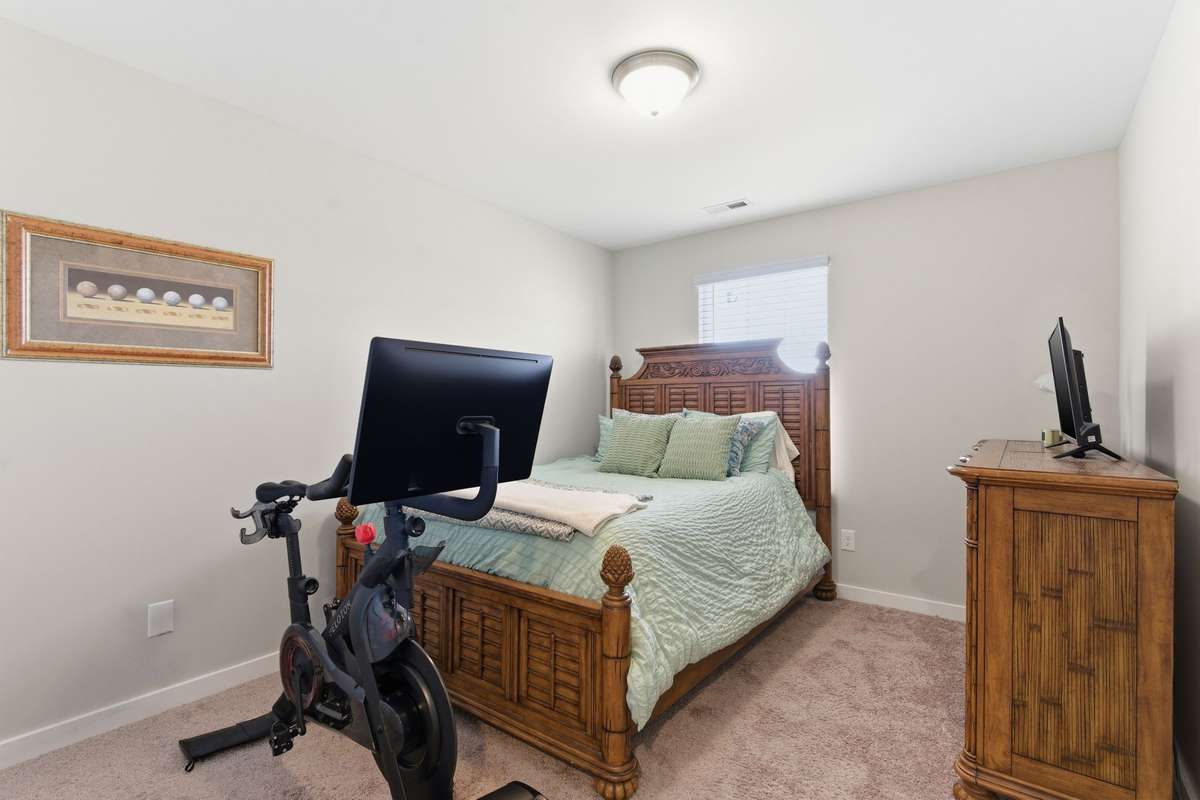 A third upstairs bedroom offers additional space for guests, a cozy nursery, or designated workout area.