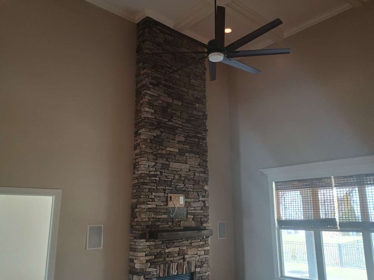 Stacked rock fireplace in living room
