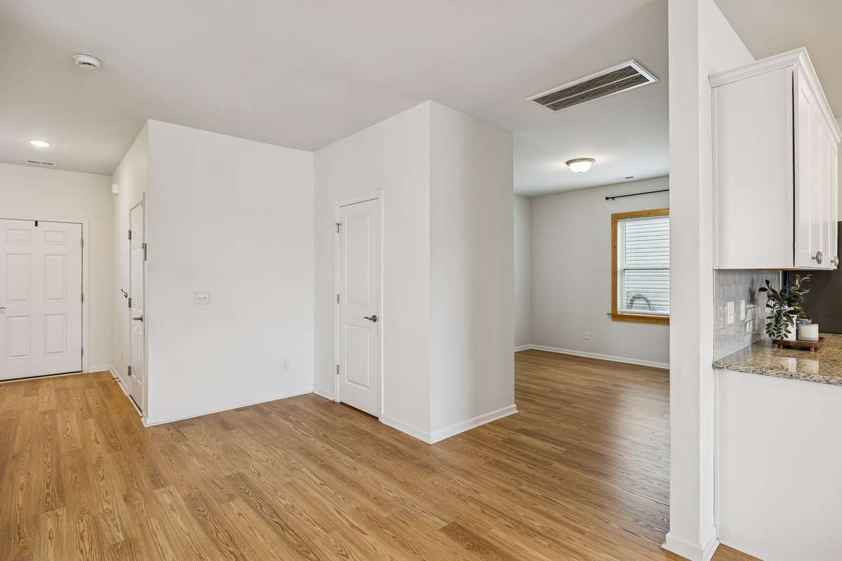 Notice the beautiful NEW engineered hardwood floors!   They extend throughout the entire main floor.