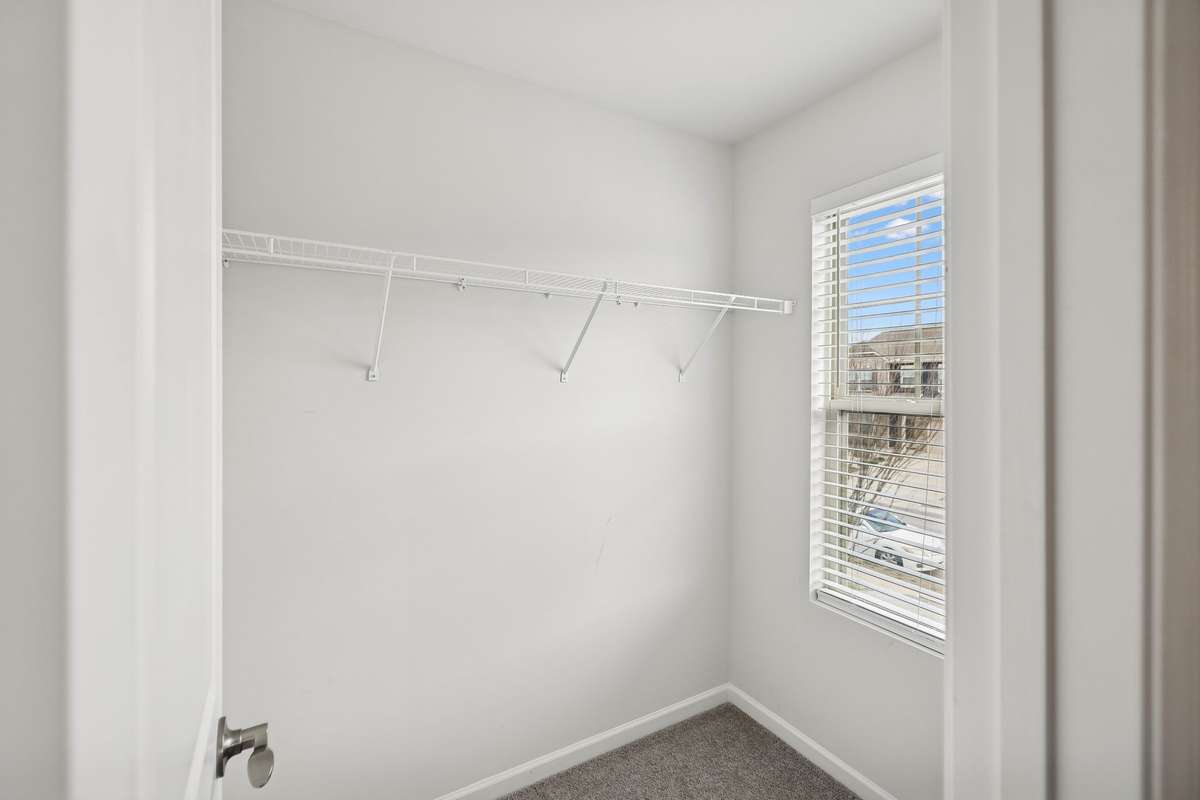 Bedroom 2 has a Nice Walk-In Closet with window.
