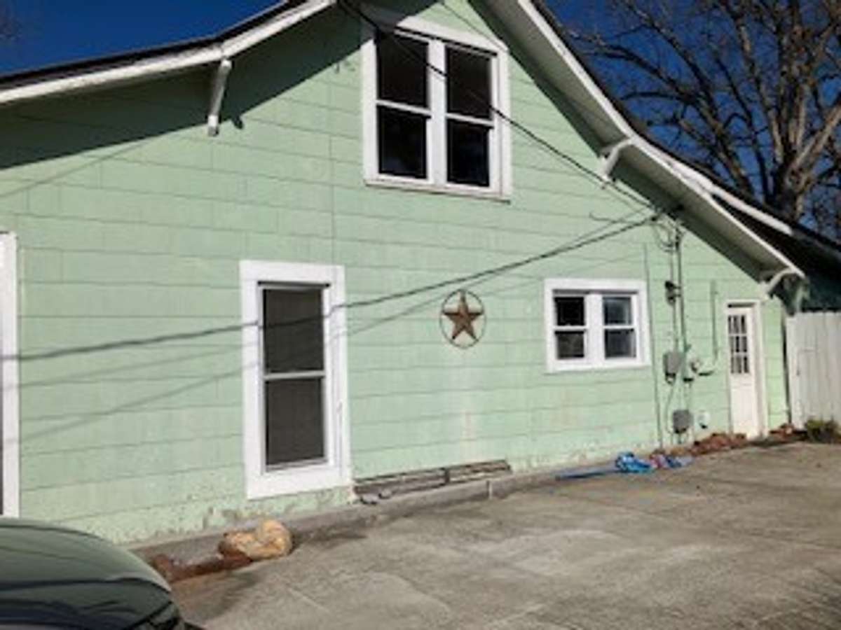 Right side with concrete parking pad