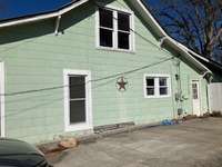 Right side with concrete parking pad