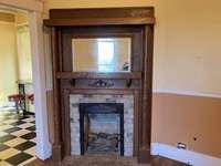 Antique fireplace in living room for aesthetics only