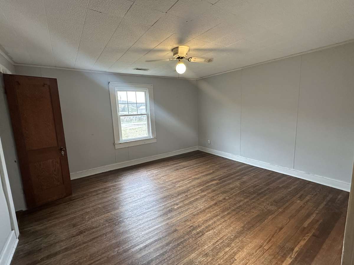Primary bedroom with original hardwood floors