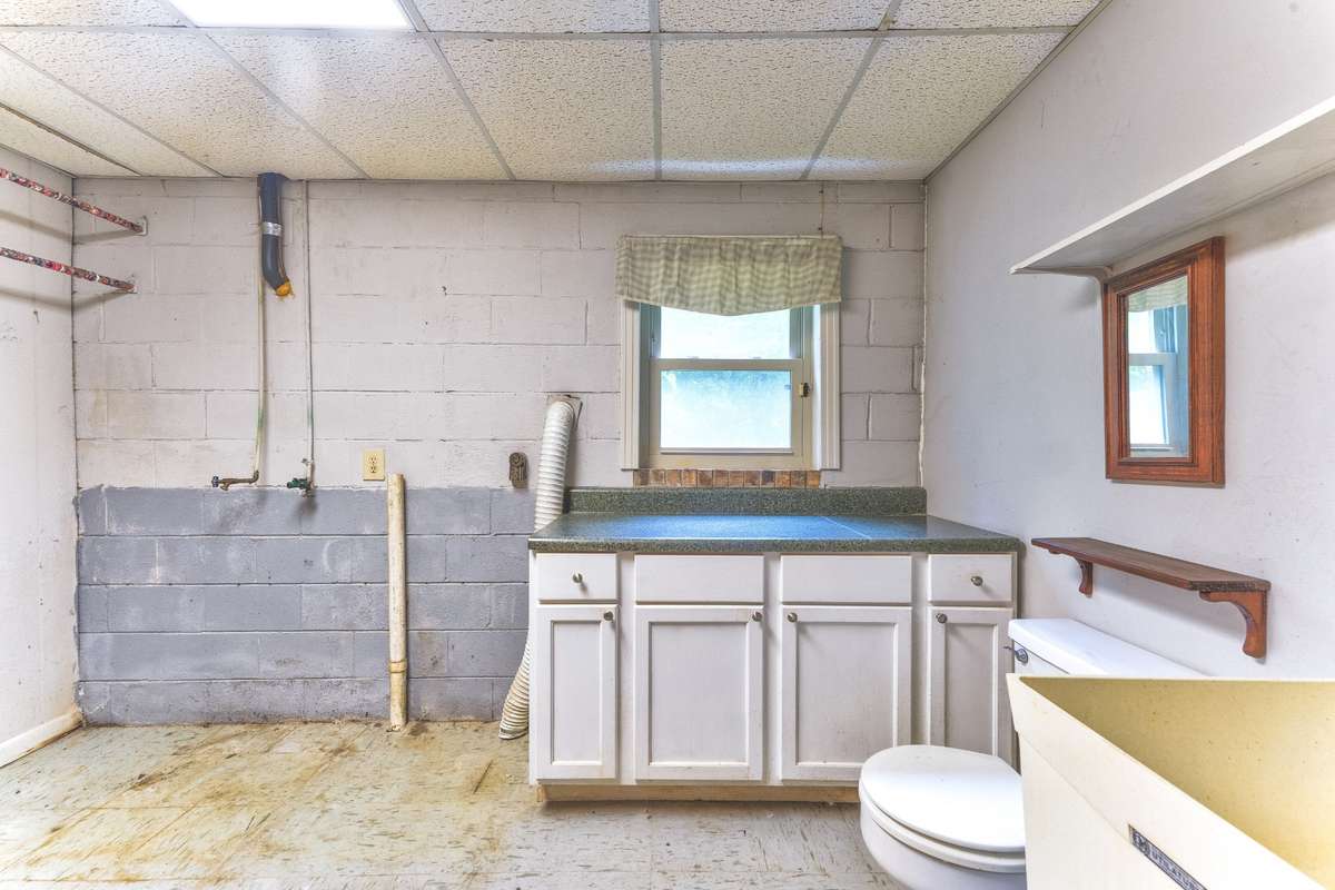 Laundry area with half bath