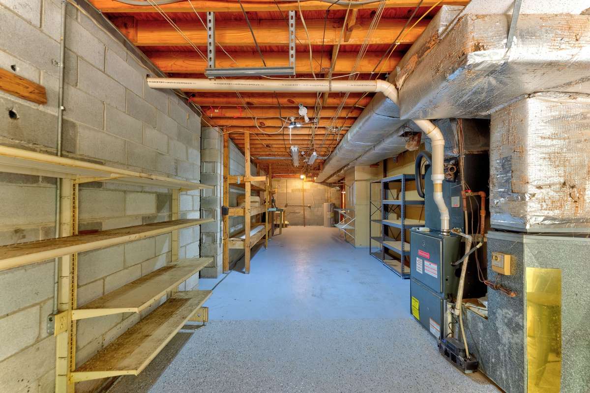 Unfinished basement space great for a shop. Also has a space under the front porch that would make a great storm room