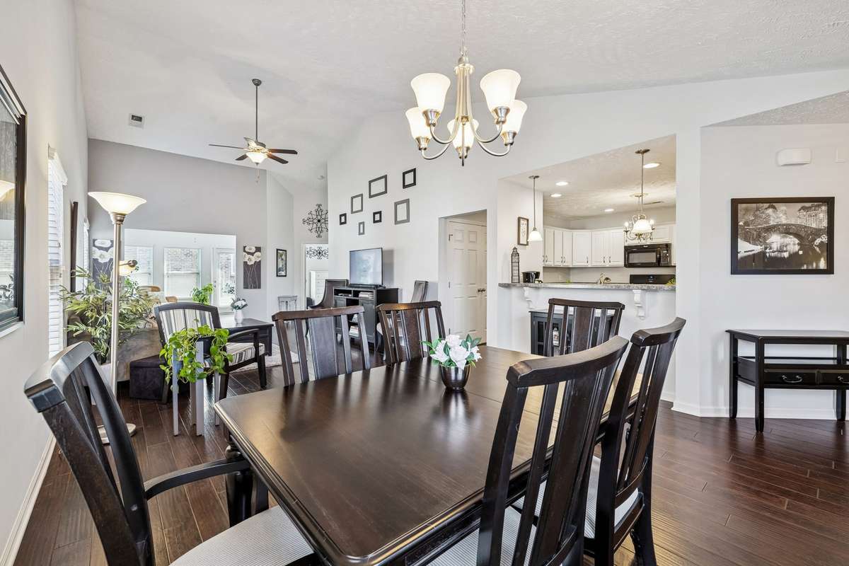 This open floor plan feels very spacious with vaulted ceilings & so much natural light with all the lovely windows