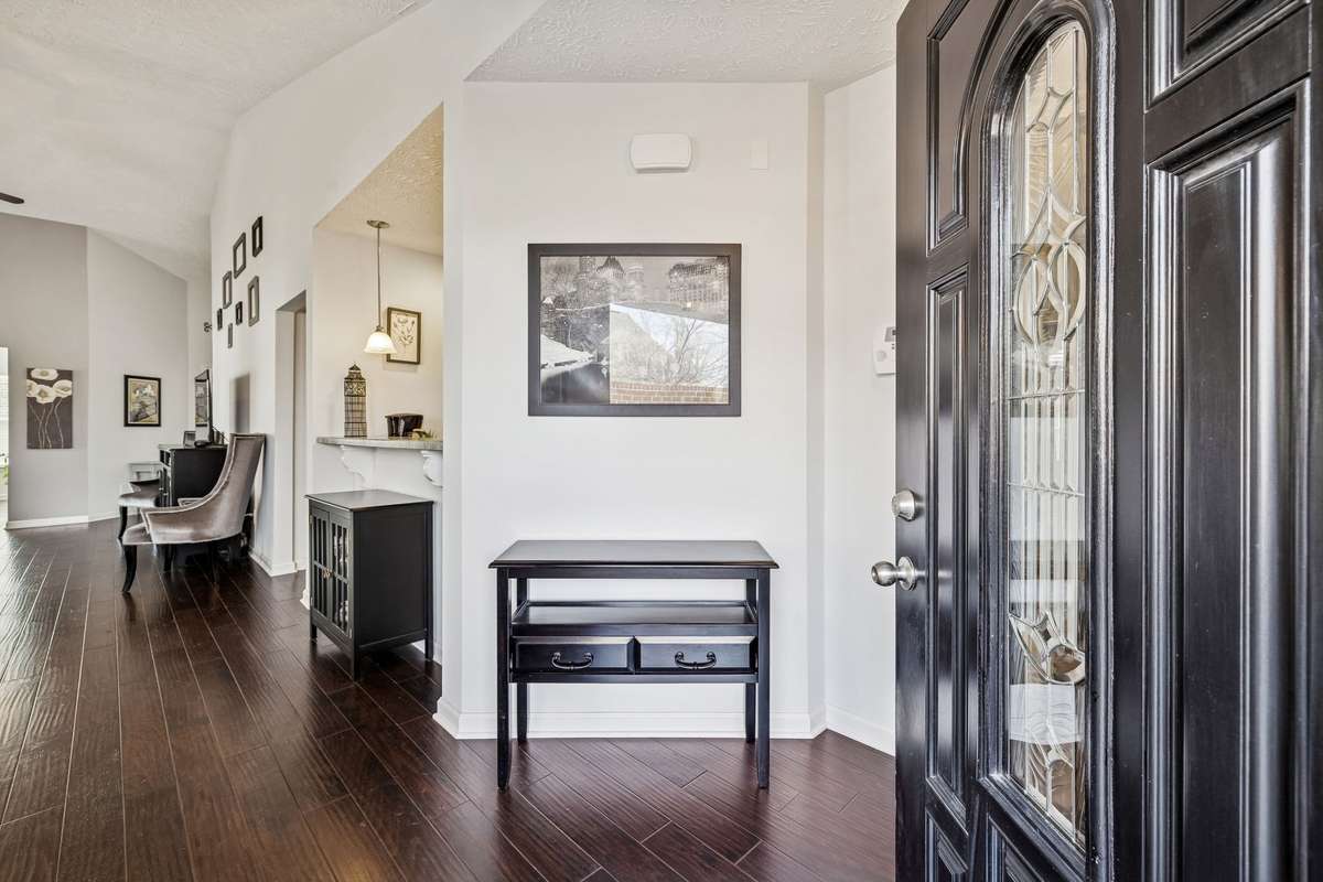 Home features vaulted ceilings and neutral paint giving a bright open & modern feel!