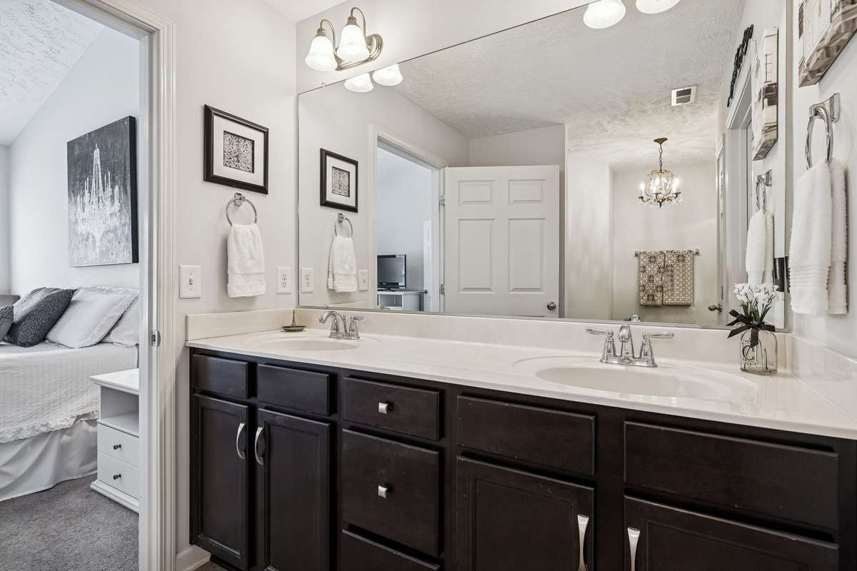 Primary ensuite bath with raised double vanity, Walk in Closet, linen closet & oversized step in shower