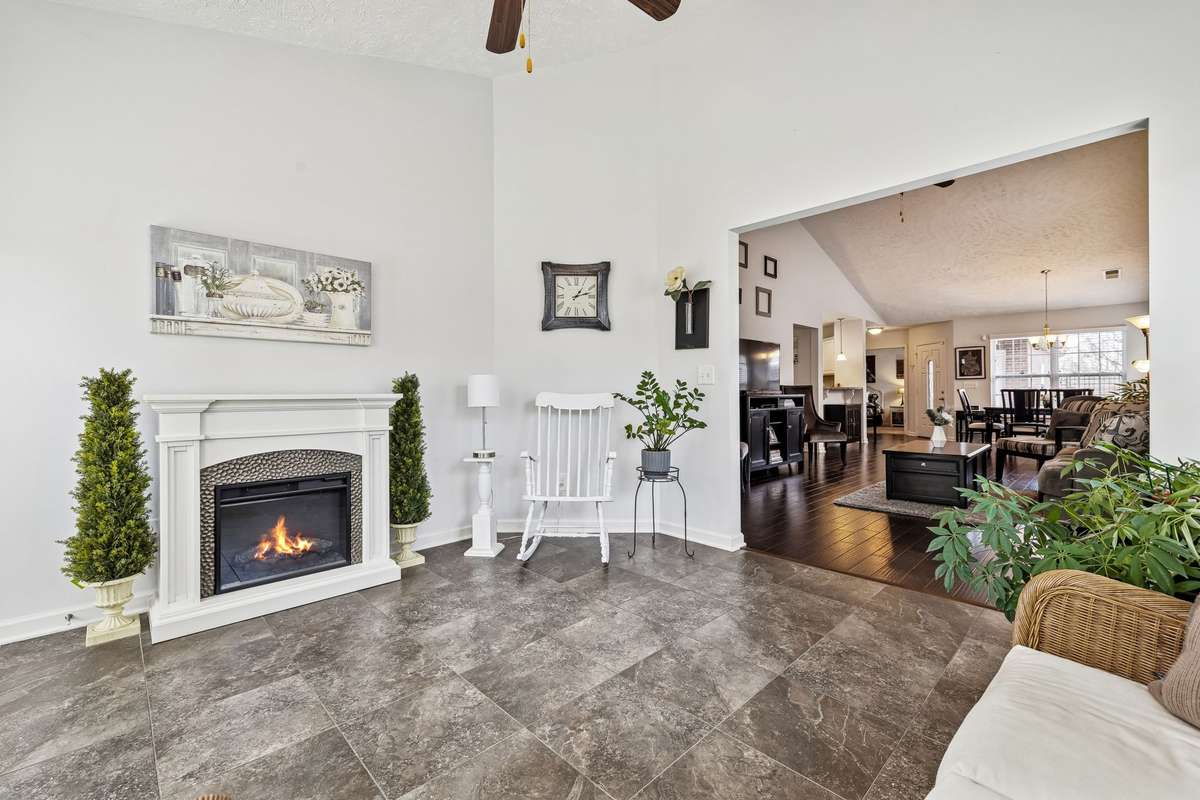 Florida / Flex room with vaulted ceiling, tile flooring + electric (plug in) fireplace that is negotiable