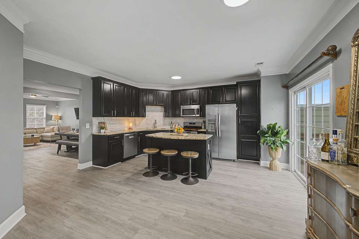 Love this kitchen!! All newer stainless steel appliances, modern cabinets, granite counters and an island perfect for prepping, dining and entertaining