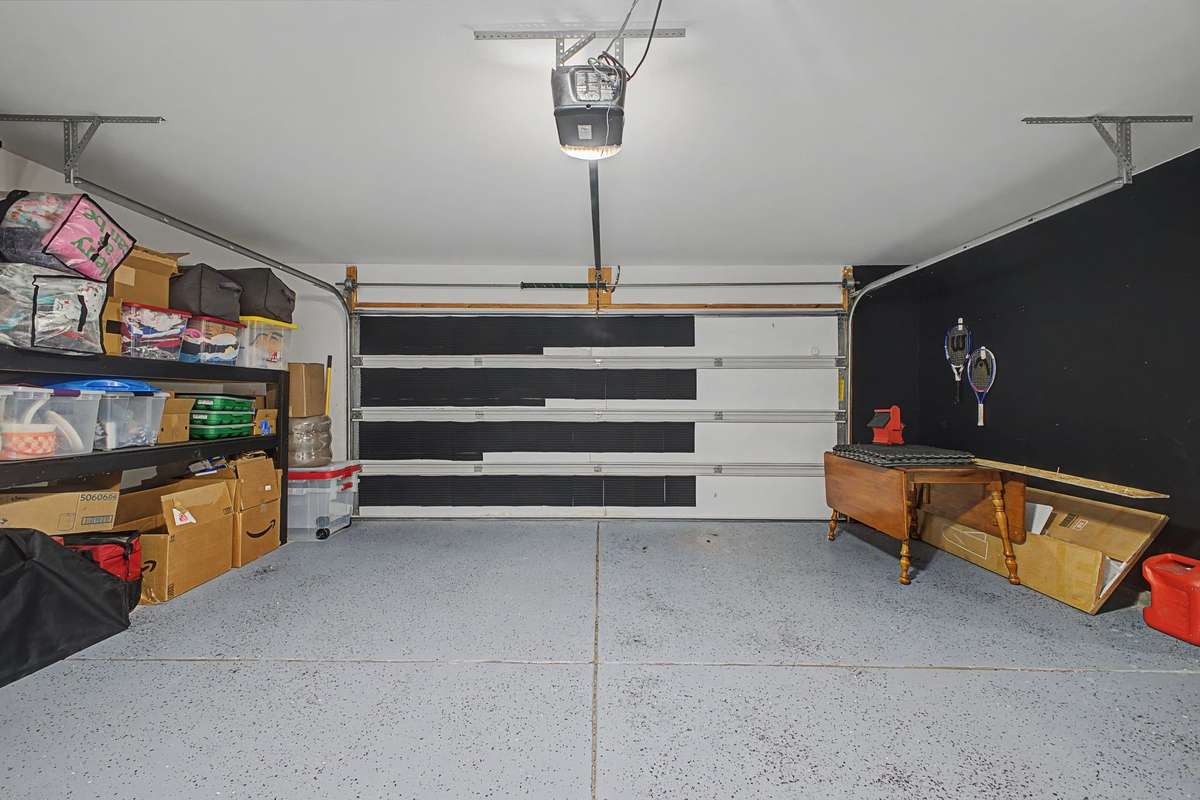 2 car garage with diamond epoxy floor and extra storage space