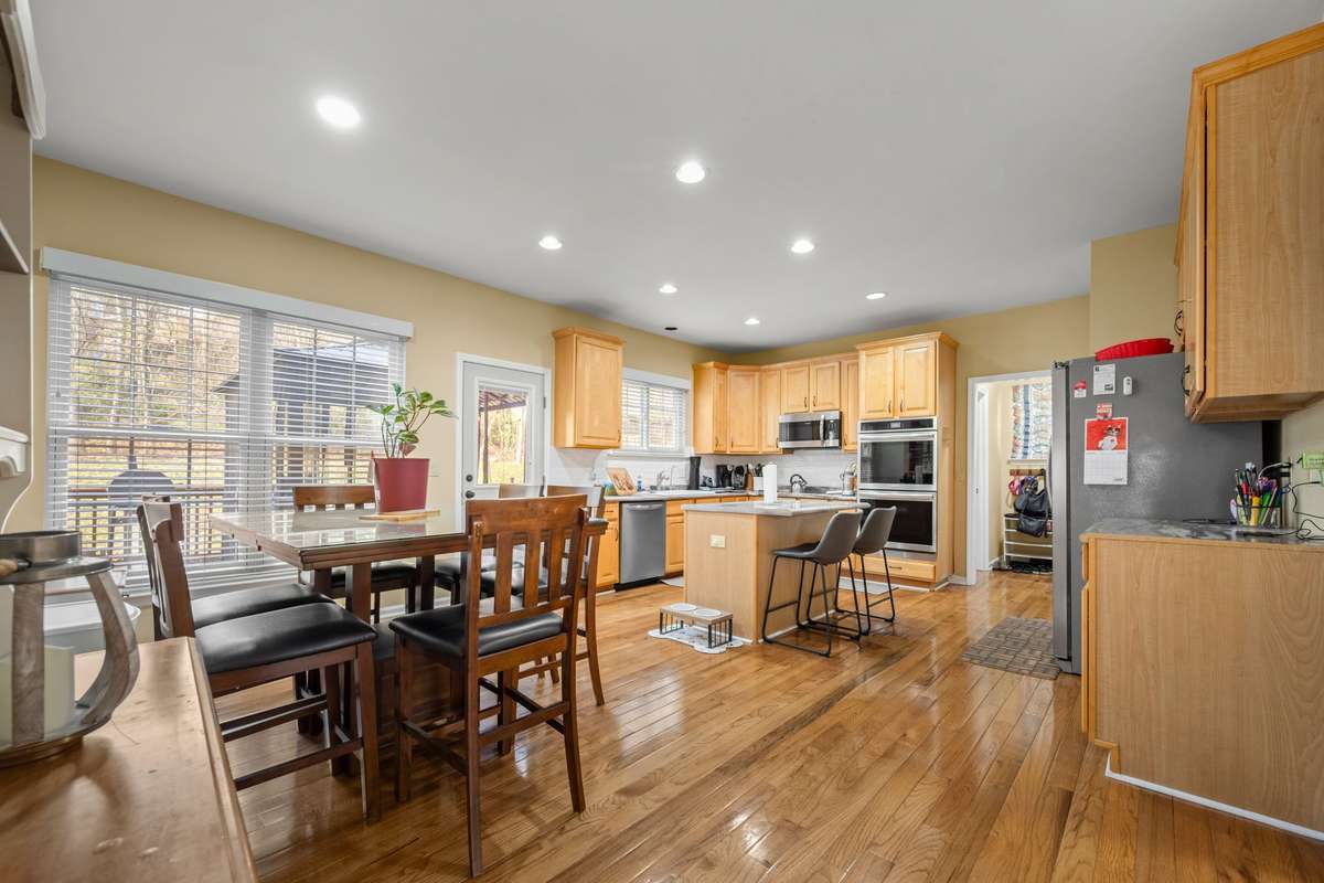 Expansive Eat-In kitchen with plenty of cabinets and separate pantry. Recently upgraded stainless steel appliance.