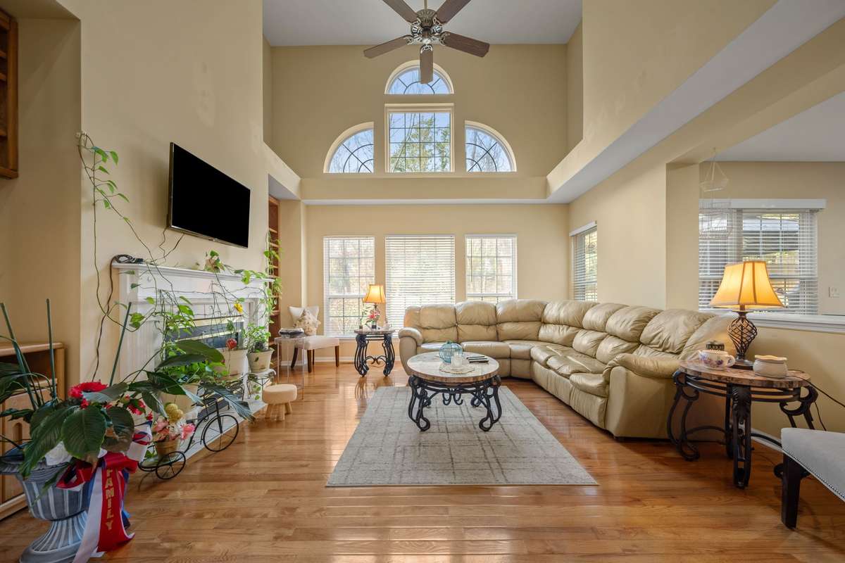 Two story living with plenty of windows for natural light.