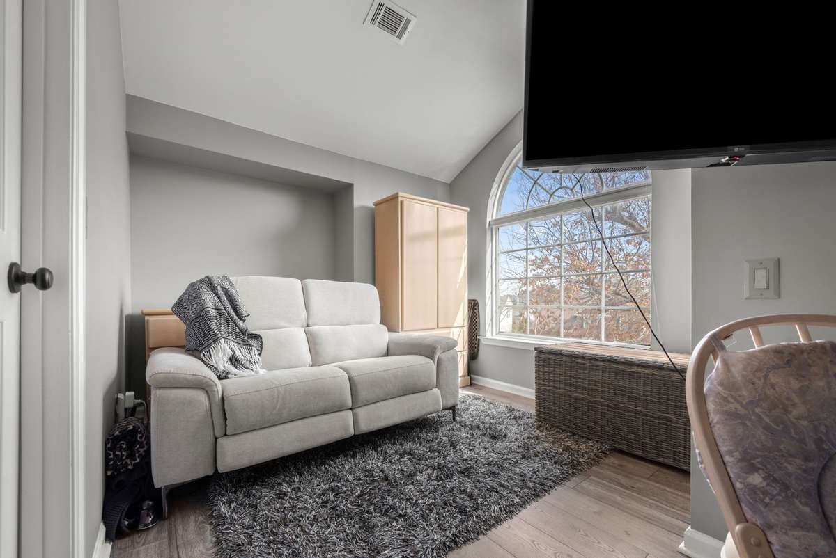 Additional sitting room with attached walk in closet. This versatile room could be utilized as a nursery, quiet area to read your favorite book or relax and watch your favorite movie!