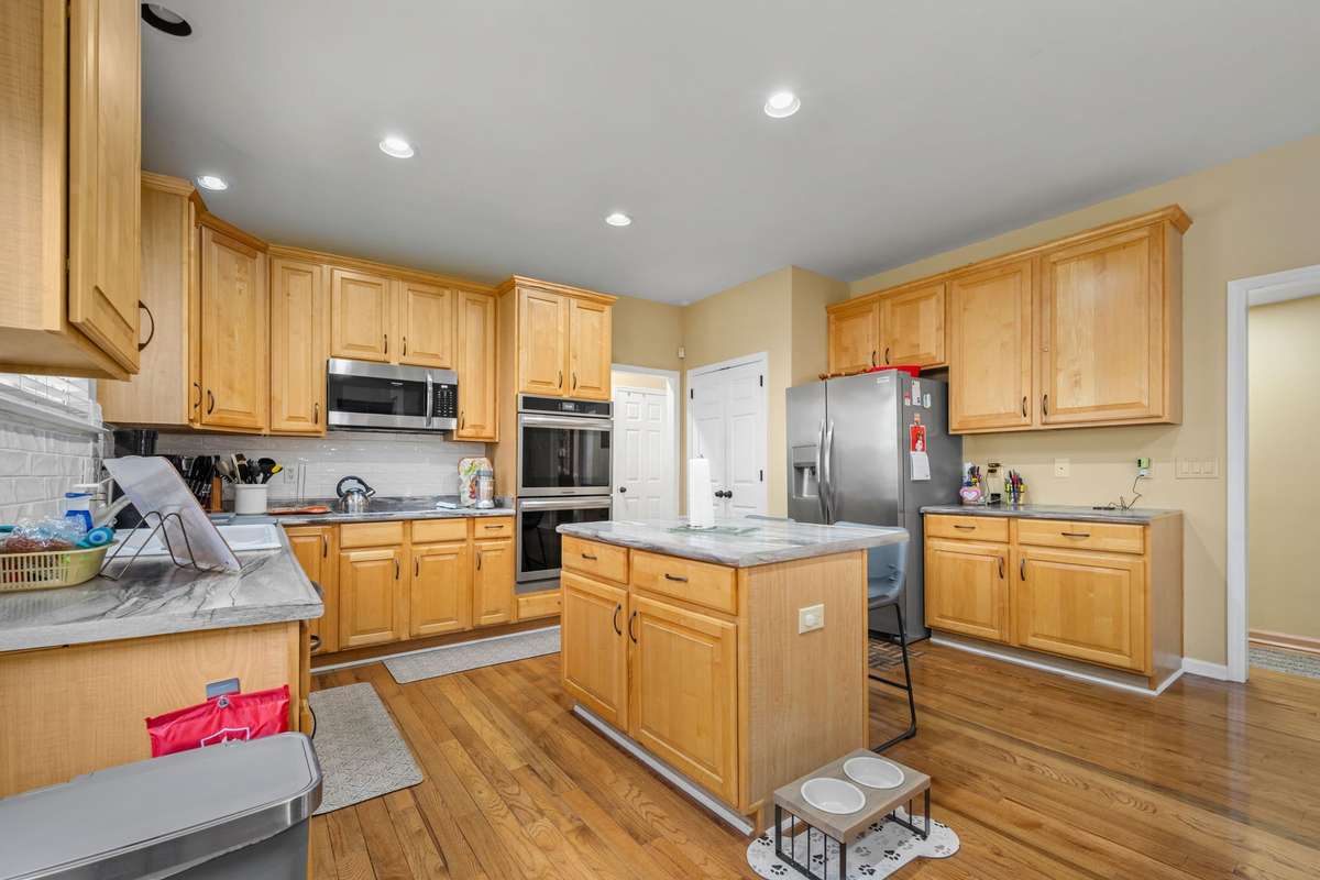 Additional stairway is located off the kitchen that leads to the Bonus room on the second floor