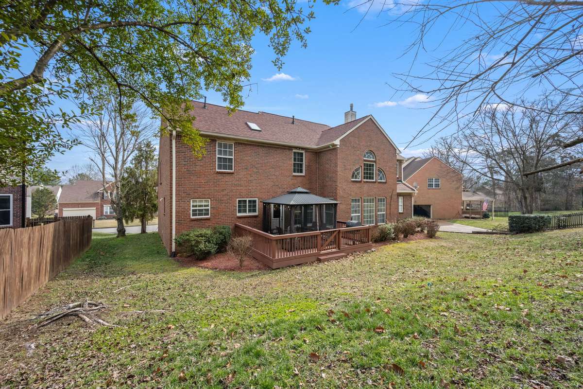 Well maintained back yard with mature trees!
