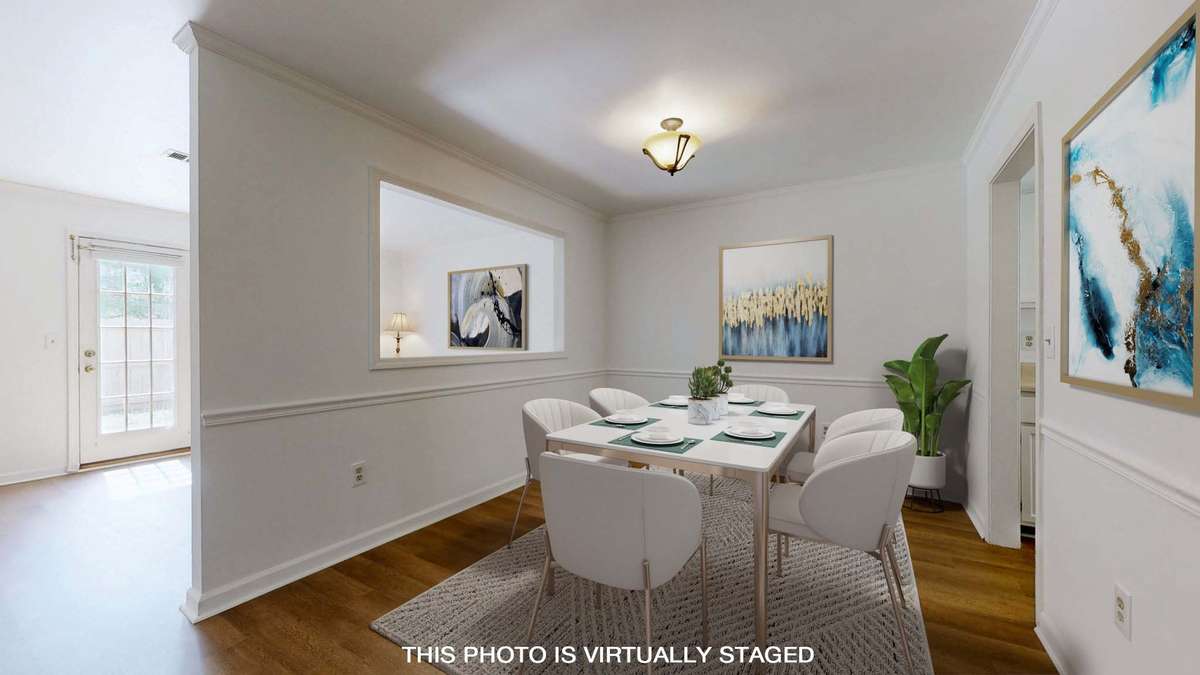 Dining with passthrough window keeps the space open.