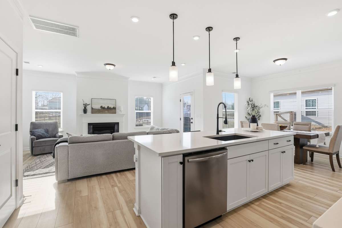 Quartz counters, upgraded fixtures, all kitchen appliances remain.