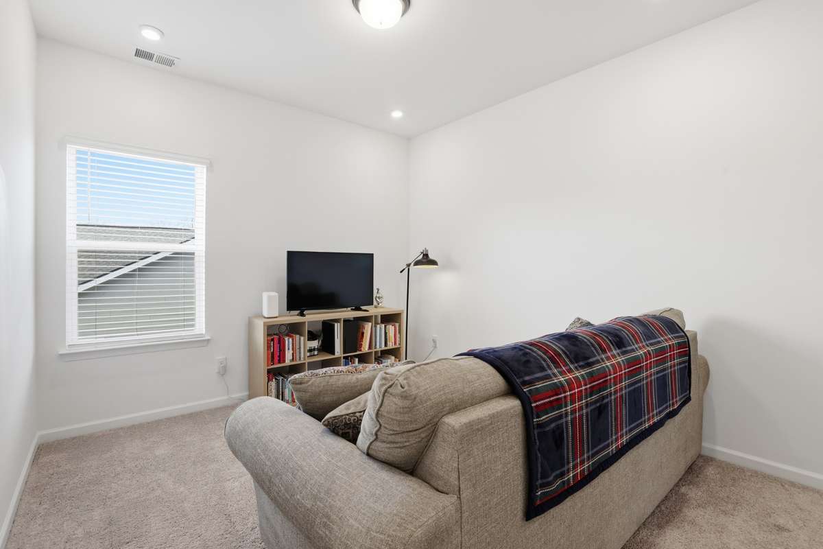 Bonus room is between primary bedroom and the other two bedrooms up.