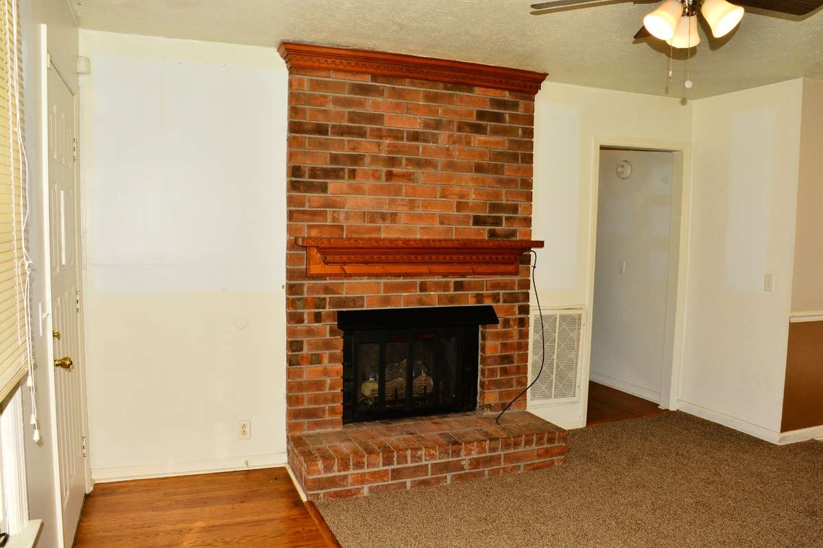 The living room features a cozy gas/wood burning fireplace for those chilly Tennessee winters with a brick hearth, and an open floor plan leading into the combination dining room/kitchen.  It is a wonderful place to entertain guest or family.
