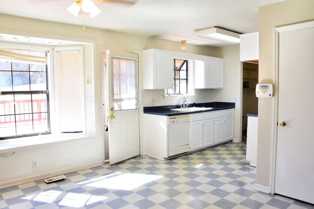 The kitchen/dining room combination features a bay window that lets the sunlight filter in that can brighten any day.
