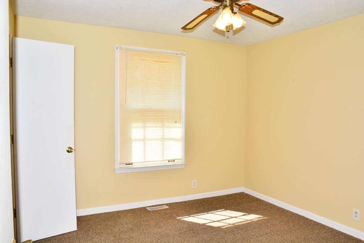 One of the other bedrooms that also has a walk-in closet.