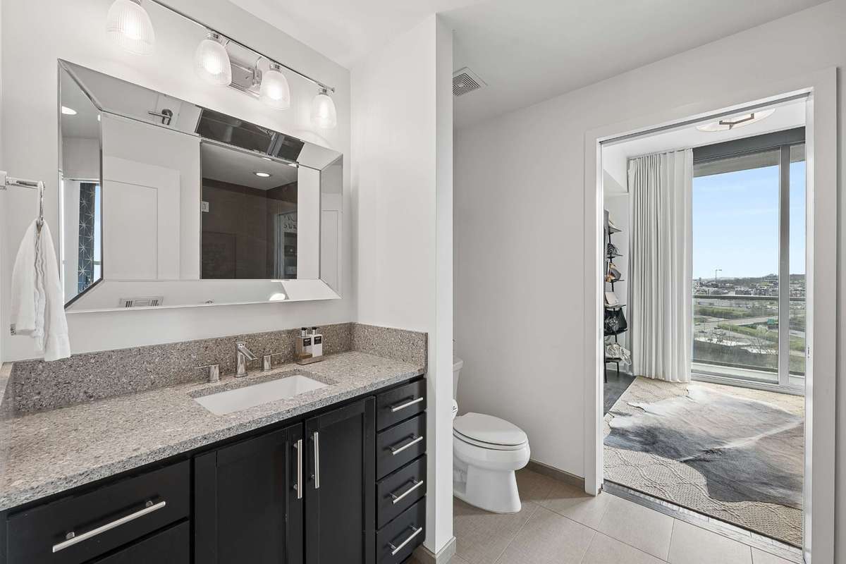 The secondary guest bath and bedroom is located off the entry hallway