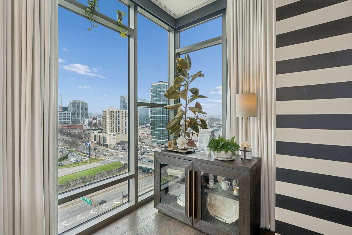 Beautiful city views from every room. This corner area of the dining room can also accommodate a desk for those work from home days...