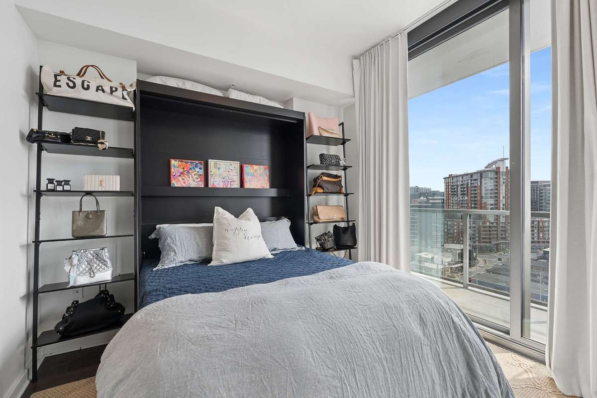 Floor to ceiling sliding doors open to your own balcony (1 of 2 balconies) with city views and rolling TN hills beyond