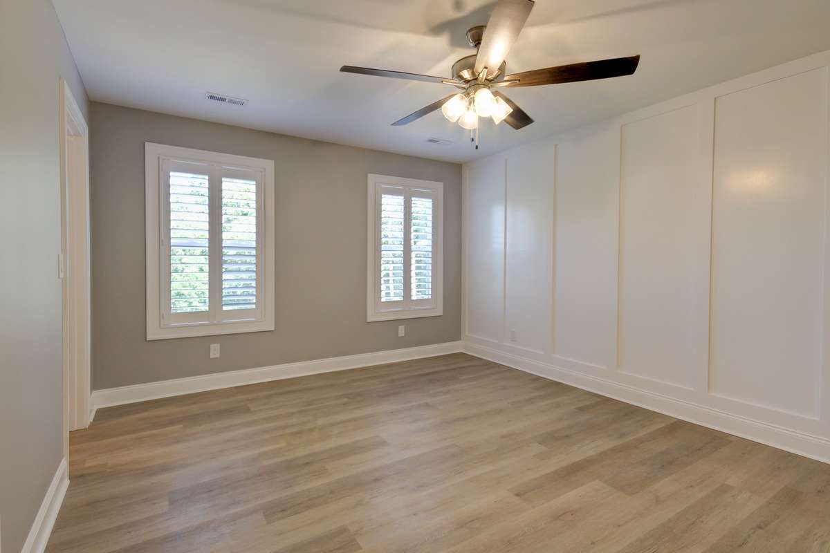Master Bedroom offers a large walk in closet and in suite bathroom. Built in blackout shades and plantation shutters