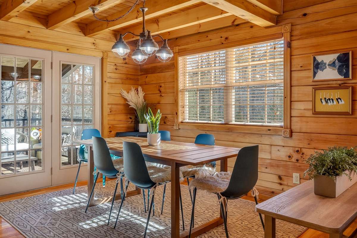 French doors leading to the back screened in deck expand you entertaining space.