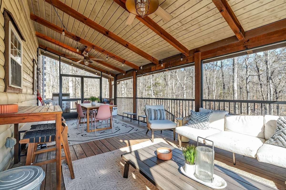 Screened in rear porch expands your entertaining space.