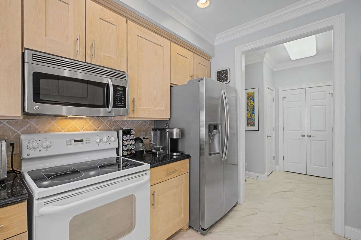 Kitchen leading to laundry, mud room and garage.
