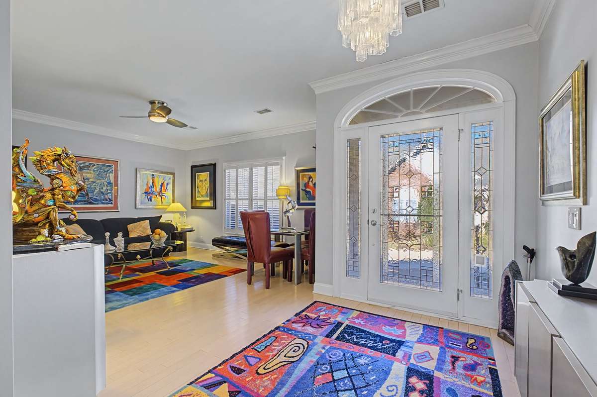 Formal living room off of entry. There are plantation blinds in all rooms.