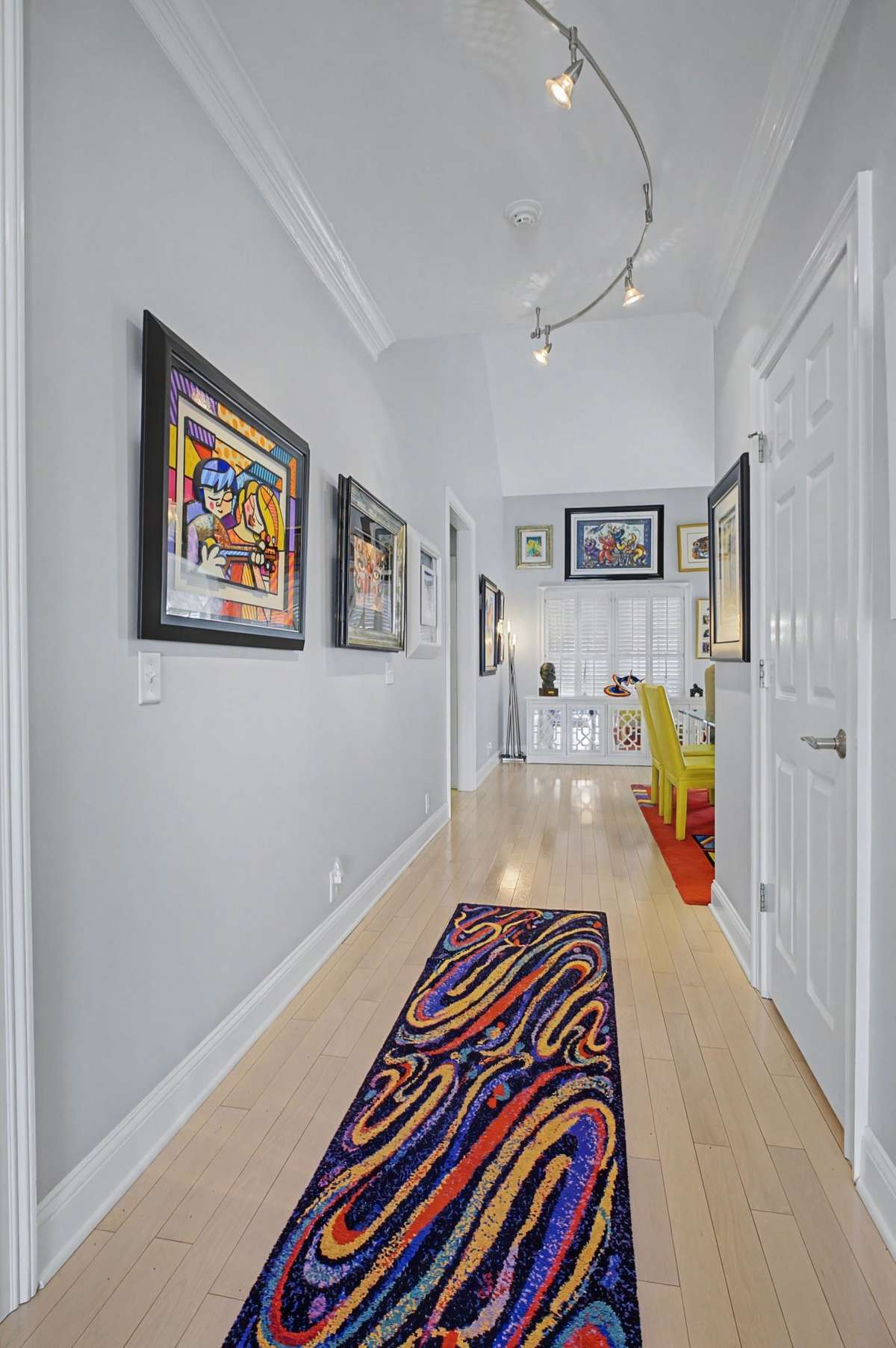 The entry hall takes you to guest bedrooms, while working your way to the kitchen/den areas.