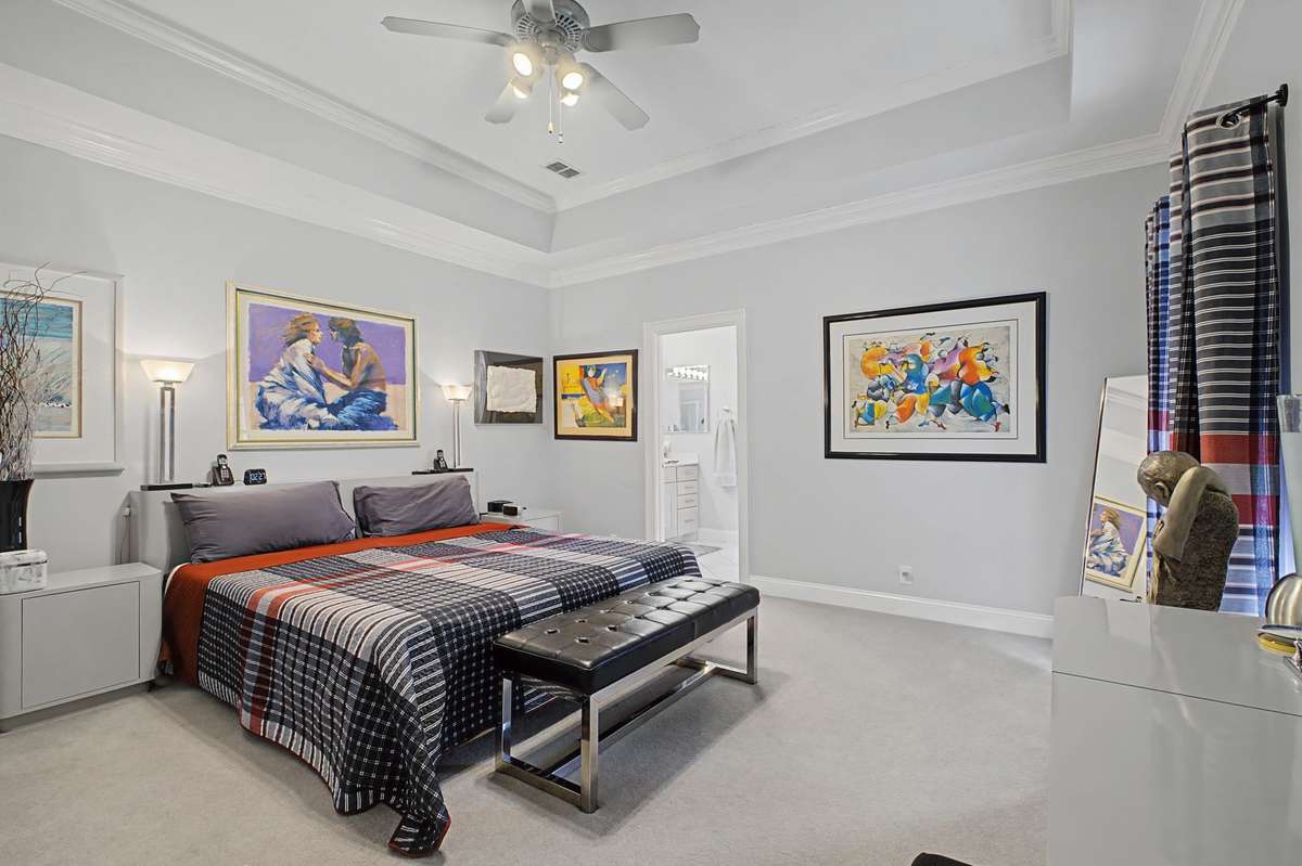 Primary bedroom is spacious with high ceiling