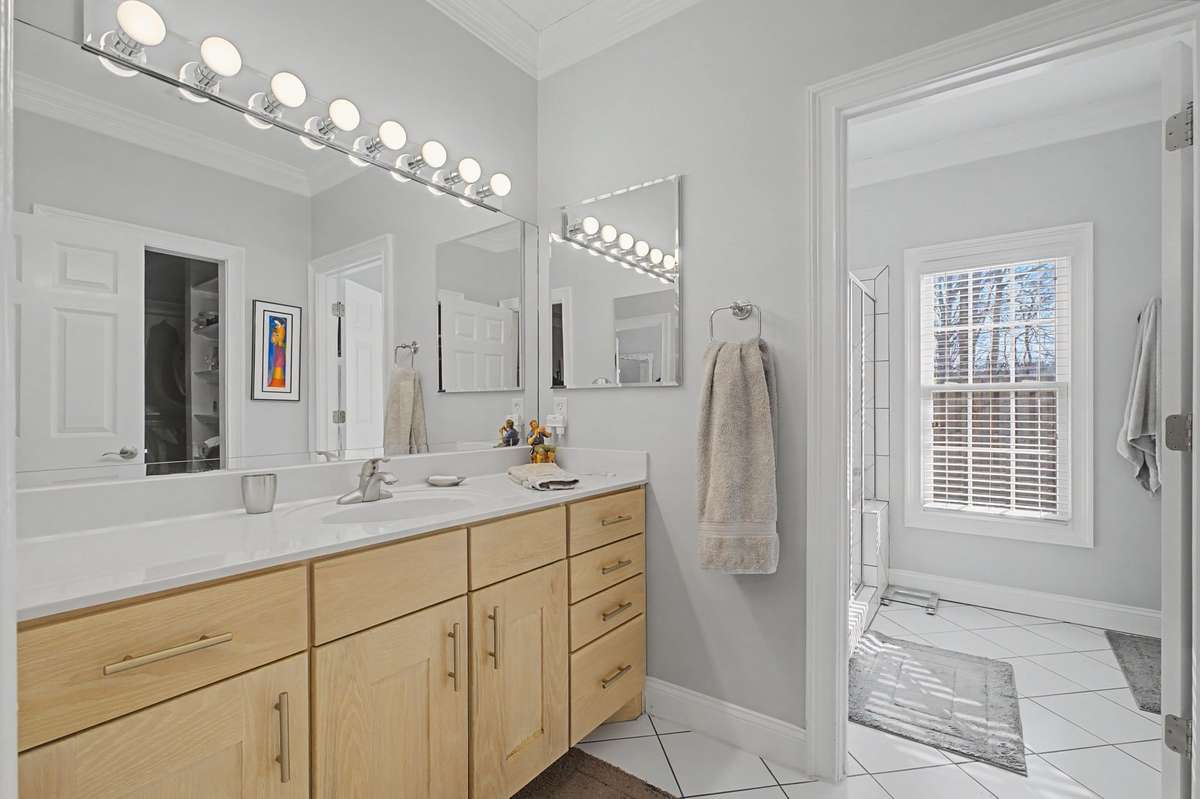 Split primary bathroom has lots of storage.