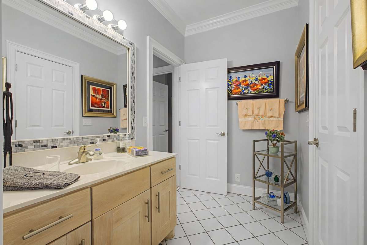 Hall bath attached to secondary bedroom.
