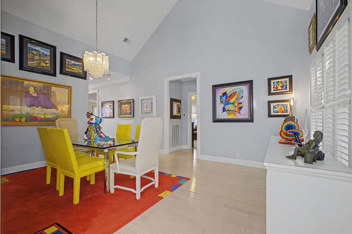 View of dining room with vaulted ceiling. Walk right out to the screened porch.