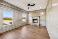 Study/office with fireplace and view of the backyard