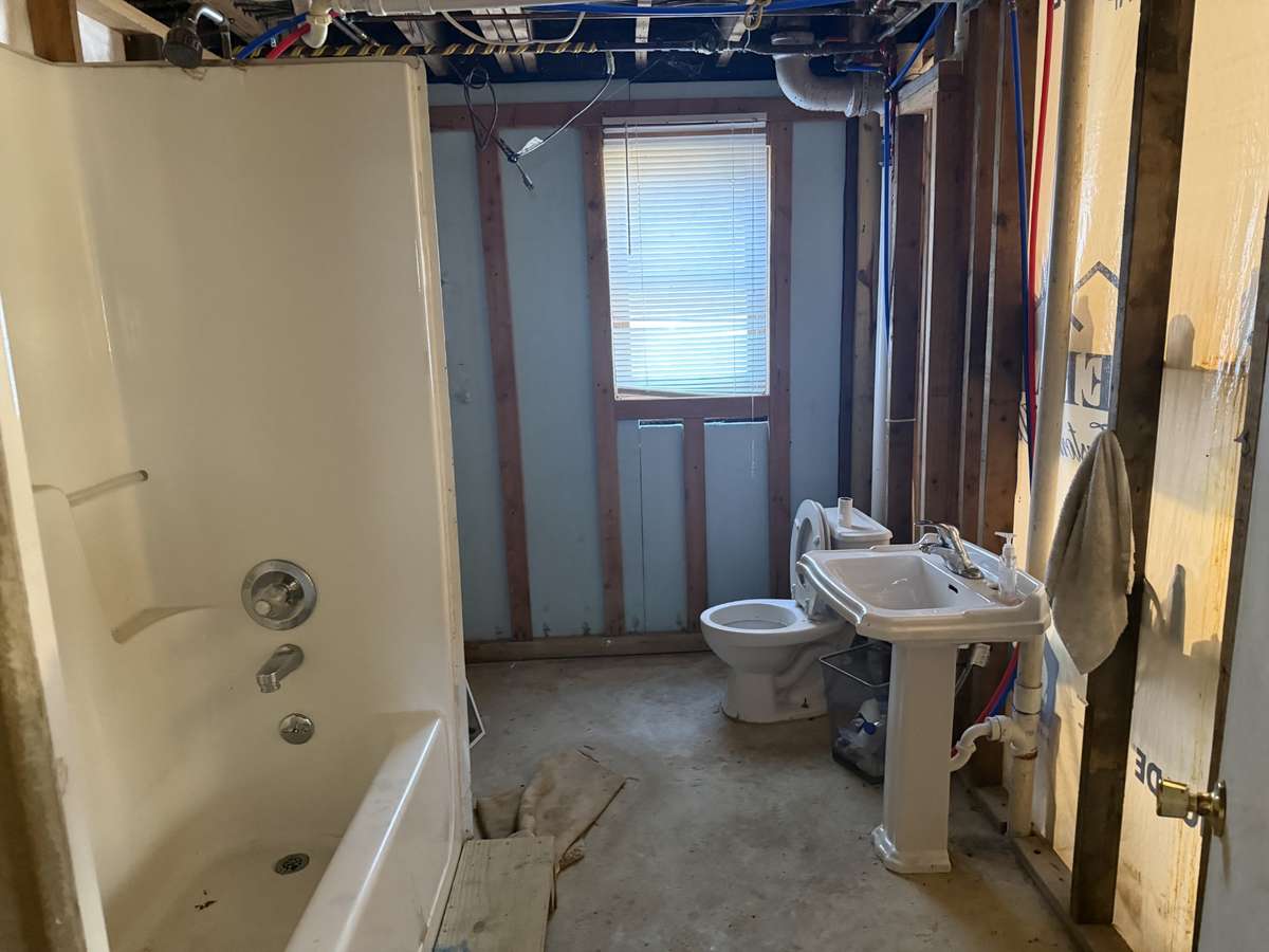 Bathroom has been mapped out and is functioning but needs finishing