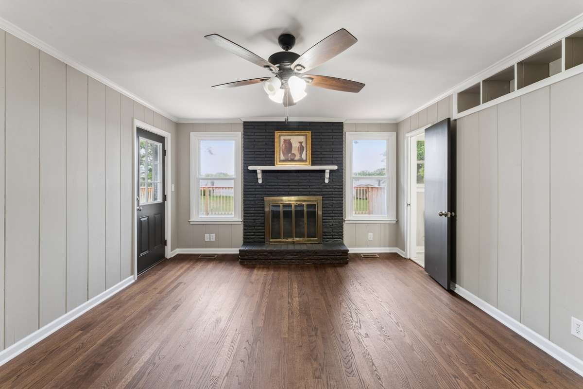 Fireplace in Primary Bedroom w door to 1/2 bath & onto deck