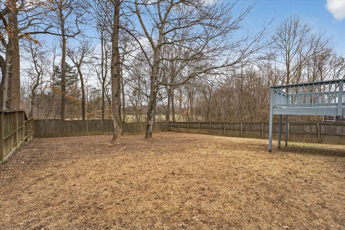 Your lot has mature trees and a wood privacy fence.