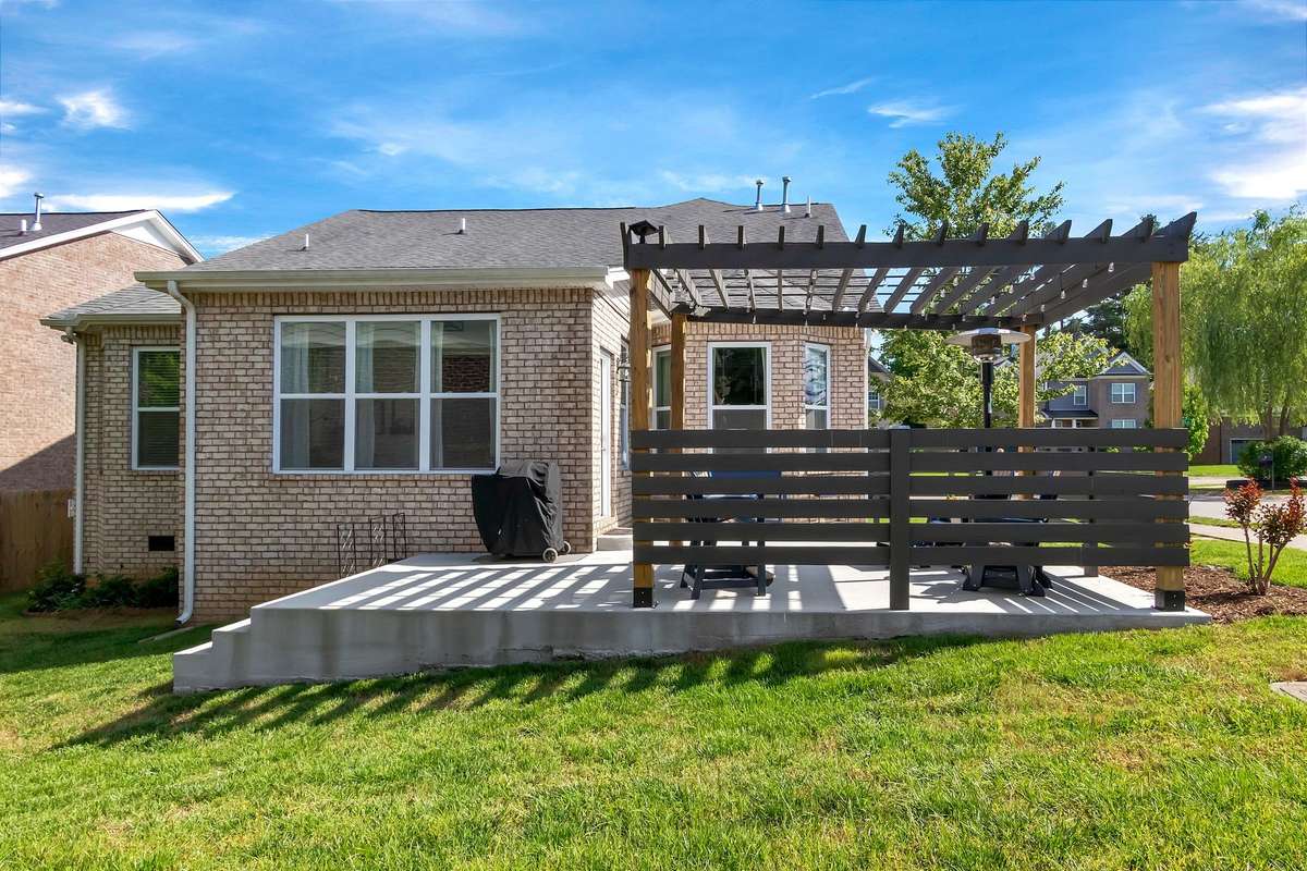 The owners extended the patio and added the pergola.