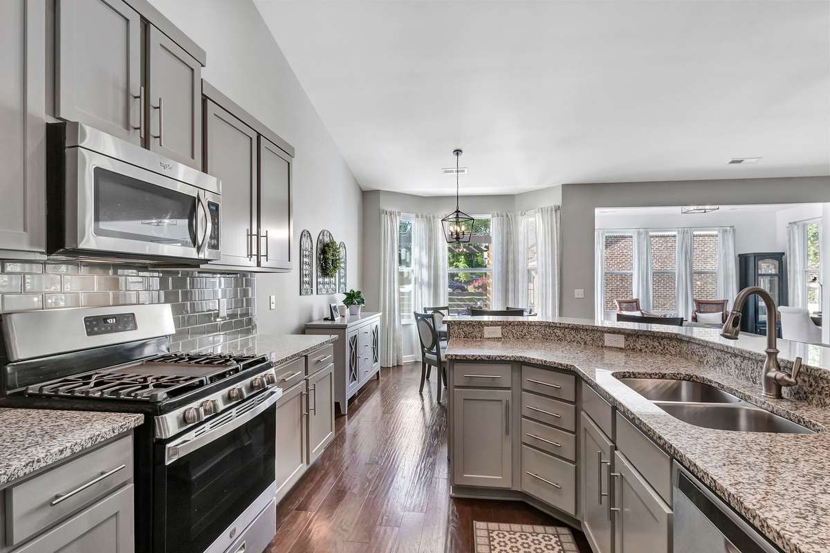This angle shows how conveniently located the breakfast nook is to the kitchen