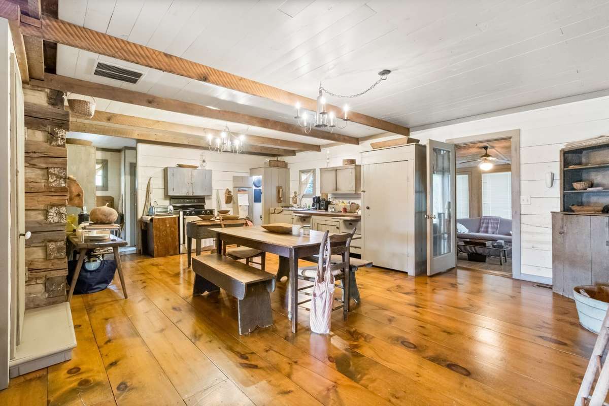 The tall cabinet to the right holds the refrigerator.